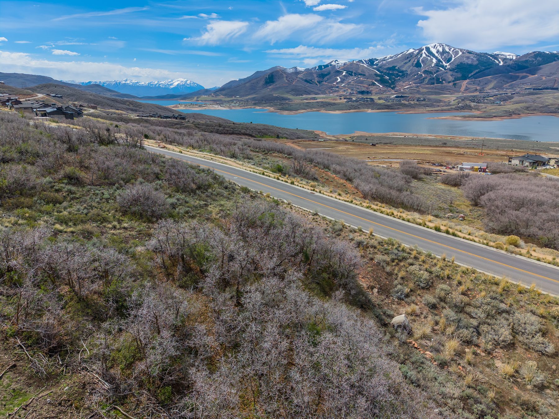 Wide aerial drone view of 11422 N Shoreline Drive lot above Jordanelle Reservoir, Hideout Utah